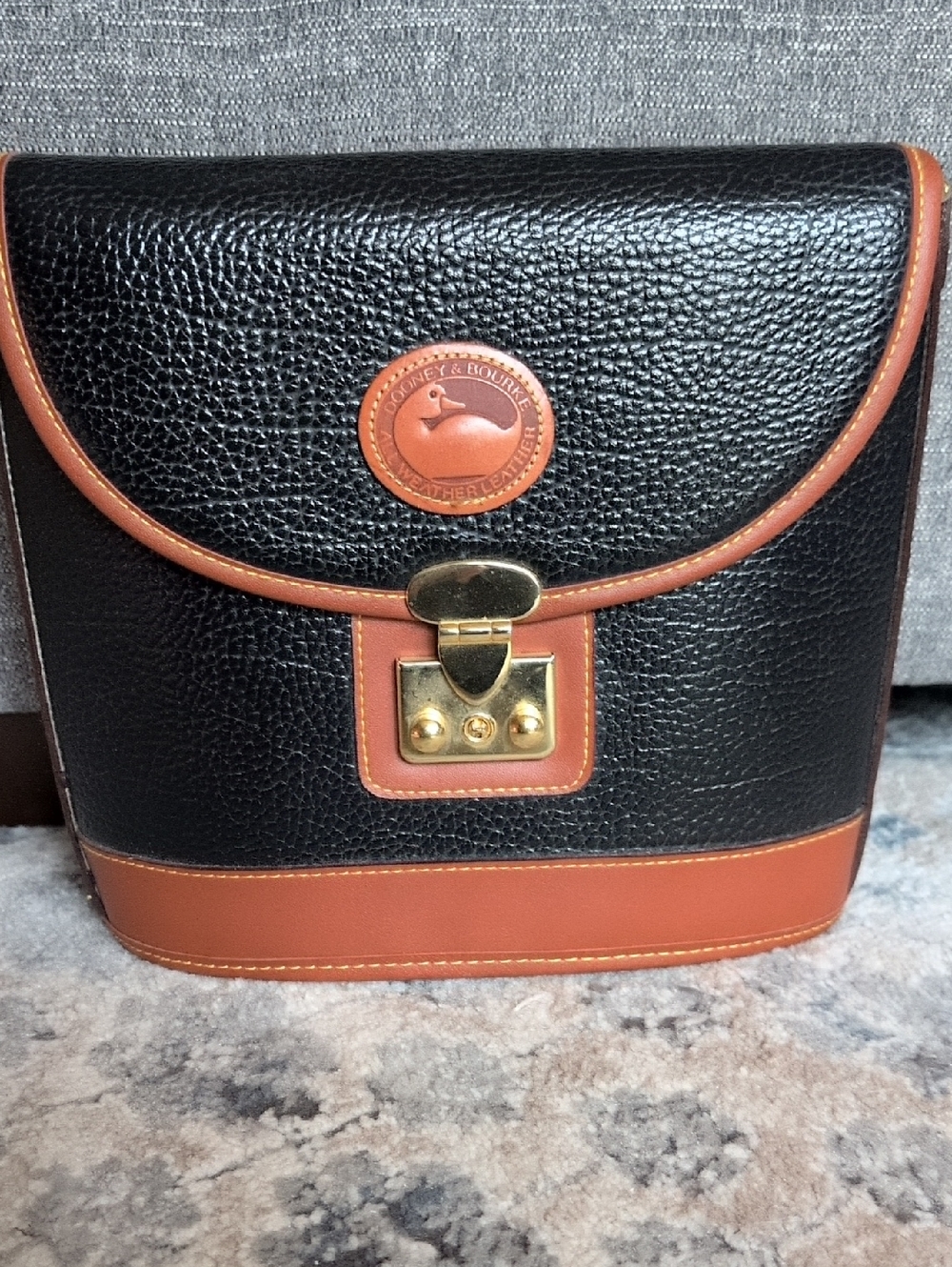 Dooney & Bourke Black with Brown Trim Pebbled Leather Bag
